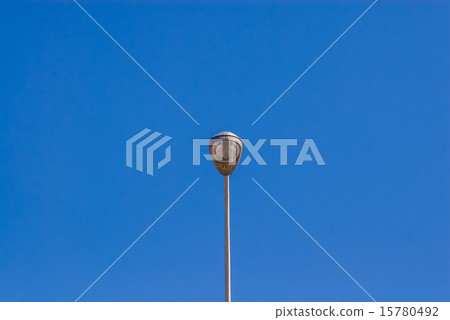 Single tall street light on sky Single tall street light on sky 15780492