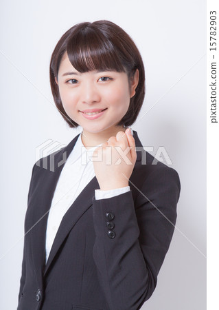 Female employee who plays guts pose Female employee who plays guts pose 15782903