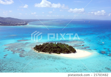 Mangagaha Island floating in the beautiful lagoon off the south island of Saipan and the Saipan island seen in the background 15783482