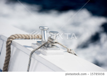 boat bollard detail on blue water background 15785038