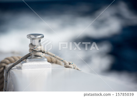 boat bollard detail on blue water background 15785039