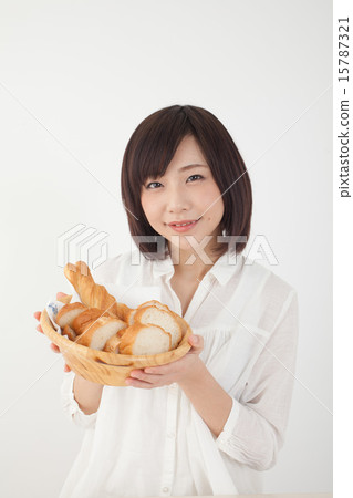 A woman with bread 15787321