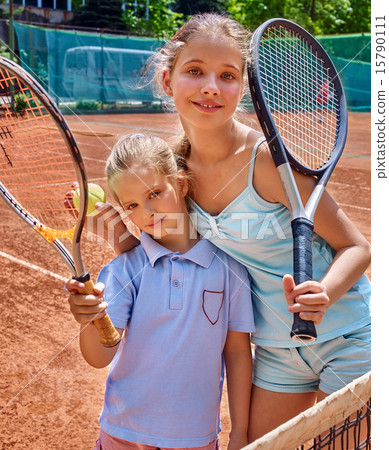 Two sister girl athlete with racket and ball Two sister girl athlete with racket and ball 15790111