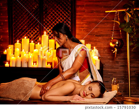 Woman having Ayurvedic spa treatment. Woman having Ayurvedic spa treatment. 15791030
