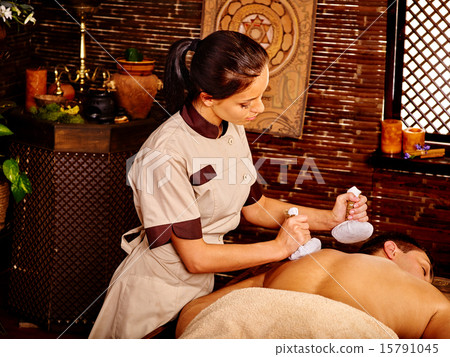 Man having Ayurvedic spa treatment. 15791045