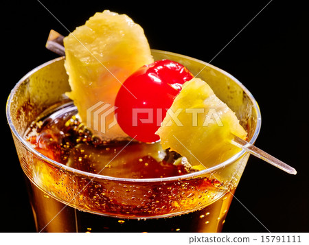 Champagne  cocktail with cherry and pineapple. 15791111