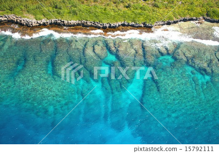 Coastline of Tropical Saipan Island surrounded by beautiful and transparent coral reefs Coastline of Tropical Saipan Island surrounded by beautiful and transparent coral reefs 15792111
