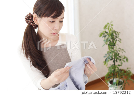 Housewife suffering from dirt on shirt collar Housewife suffering from dirt on shirt collar 15792212