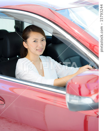 A woman driving a car A woman driving a car 15793244