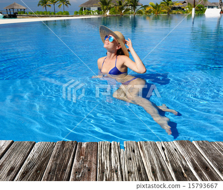 Woman at poolside 15793667
