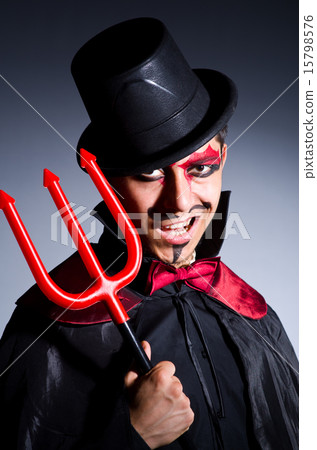 Man in devil costume in halloween concept 15798576