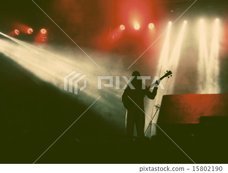 Guitarist silhouette in smoke during concert 15802190