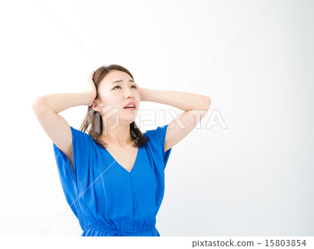 A young woman holding a head 15803854