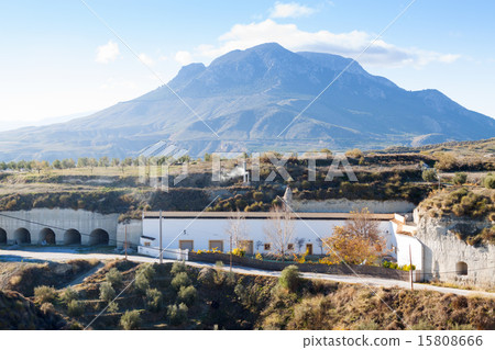 Dwelling  caves built into rock 15808666