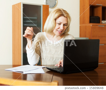 Working woman with notebook and documents 15809648