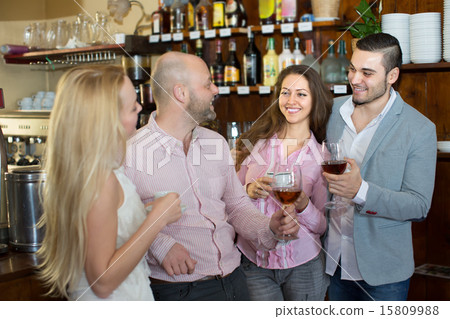 Young happy adults at bar 15809988