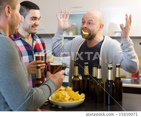 Three men at house party Three men at house party 15810071