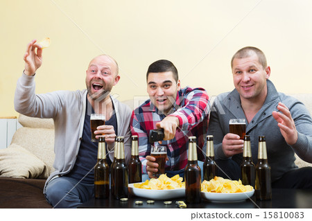 Fans watching hockey game heatedly 15810083