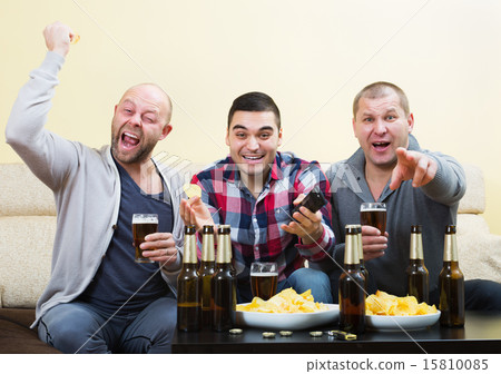 Fans watching hockey game heatedly 15810085