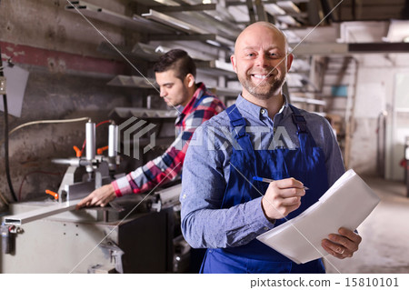 Worker at factory with boss 15810101