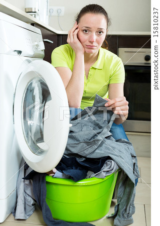 Unhappy girl with dirty clothes Unhappy girl with dirty clothes 15810237