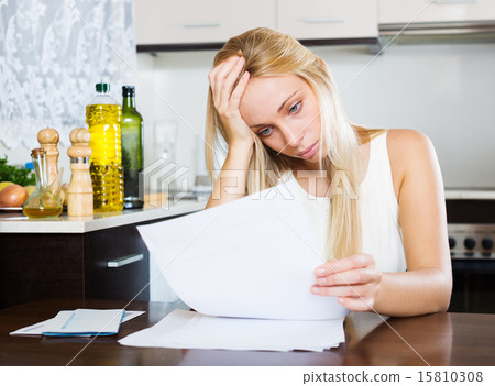 serious woman staring documents 15810308
