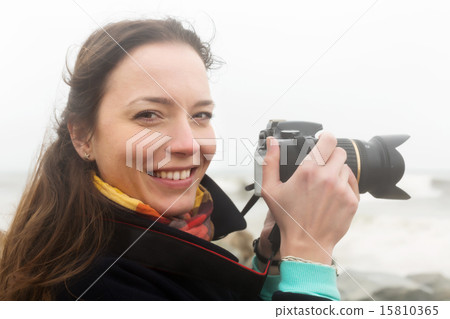 photographer taking photo of stormy sea photographer taking photo of stormy sea 15810365