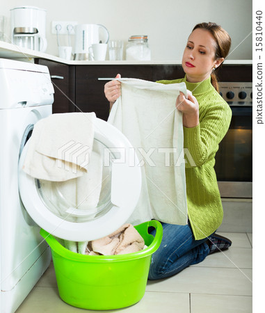 Woman with washing machine 15810440
