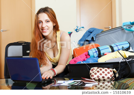 Young woman buying tickets online Young woman buying tickets online 15810639