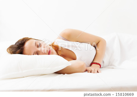 Pretty girl in shirt sleeping on white Pretty girl in shirt sleeping on white 15810669
