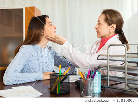 Doctor examines young girl Doctor examines young girl 15810803