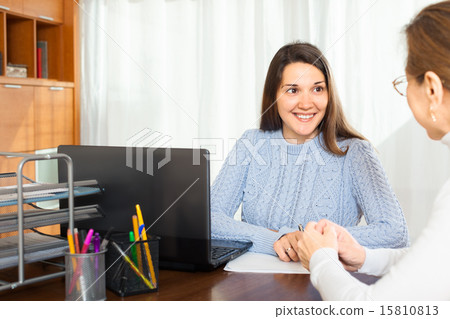 Elderly woman talking with smiling girl 15810813