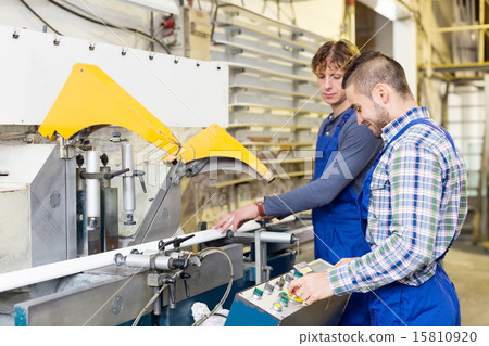 Couple of workmen at factory 15810920