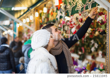 Couple choosing Christmas decoration 15811045