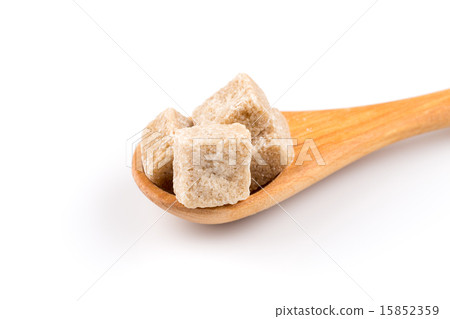 brown sugar in a wooden spoon 15852359
