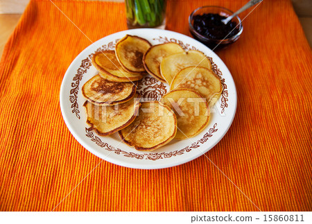 Hot pancakes with strawberry jam on napkin Hot pancakes with strawberry jam on napkin 15860811