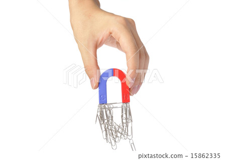 Human hand holding a magnet Human hand holding a magnet 15862335