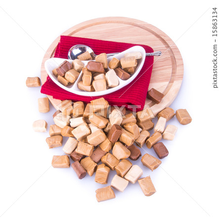 caramel candies on a background. caram 15863134