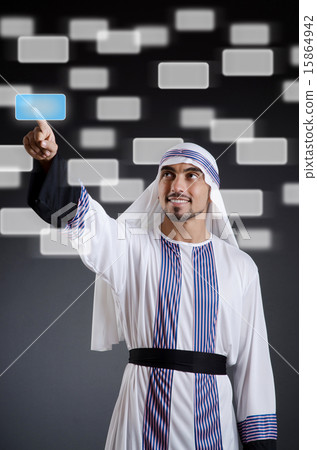 Arab businessman pressing virtual buttons Arab businessman pressing virtual buttons 15864942