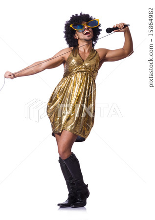 Man in female clothing singing with mic Man in female clothing singing with mic 15864982