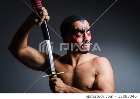 Man with sword and face paint 15865040