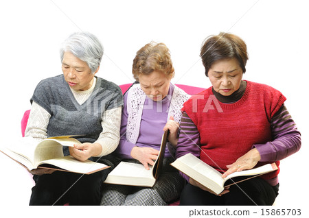 Three women of elderly who are reading difficult books 15865703