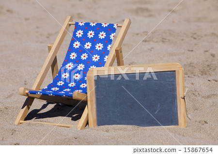 Sun Chair and Slate with Copy Space on the Beach 15867654