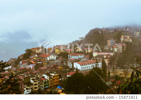 View of Sapa city in the mist, Sapa, Vietnam View of Sapa city in the mist, Sapa, Vietnam 15871911