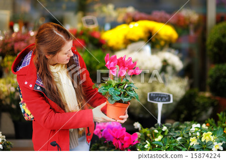 Young woman selecting fresh flowers 15874224