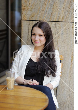 Young woman in outdoor cafe Young woman in outdoor cafe 15875126