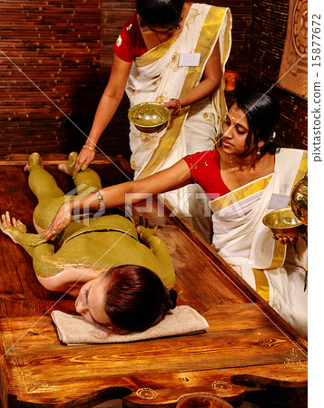Woman having Ayurvedic body spa massage. Woman having Ayurvedic body spa massage. 15877672