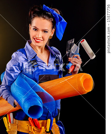 Woman builder with construction tools. 15877756
