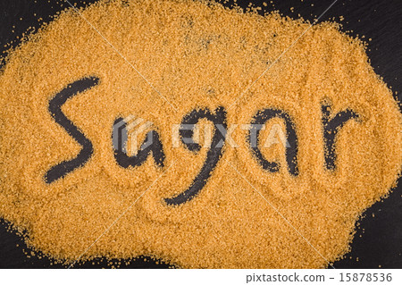 word sugar written in brown granulated sugar 15878536