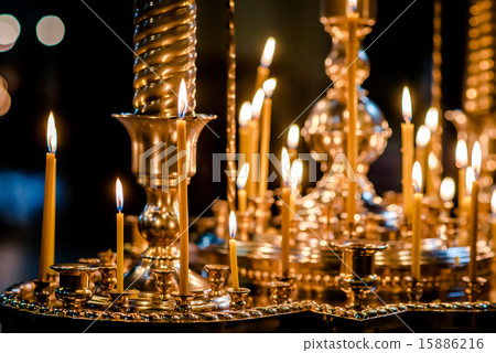 Burning candles in a church 15886216